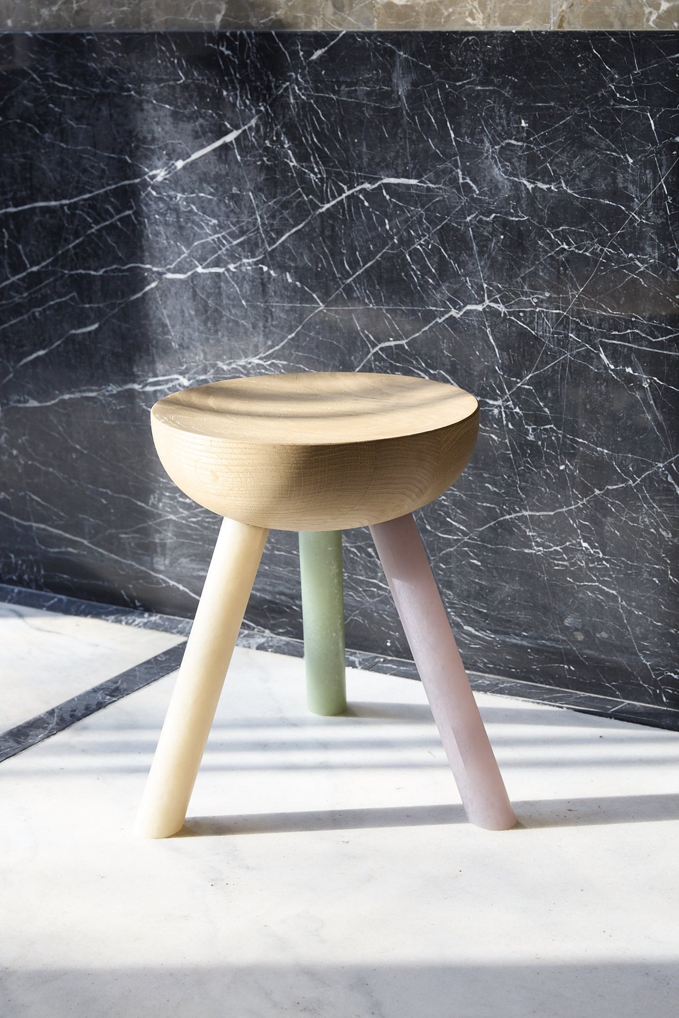 Low NANO Stool against a dark marble wall