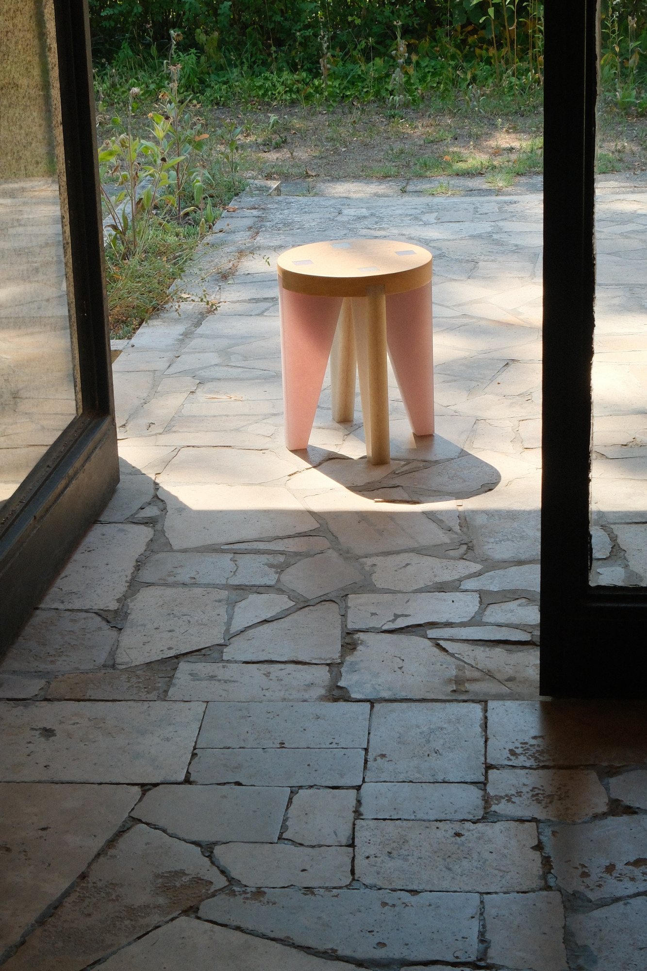 NANO Stool on a sunlit stone terrace