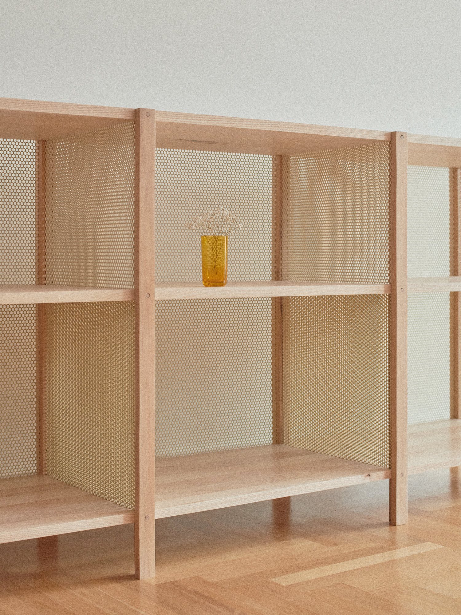 Honey Shelf corner with a yellow glass vase