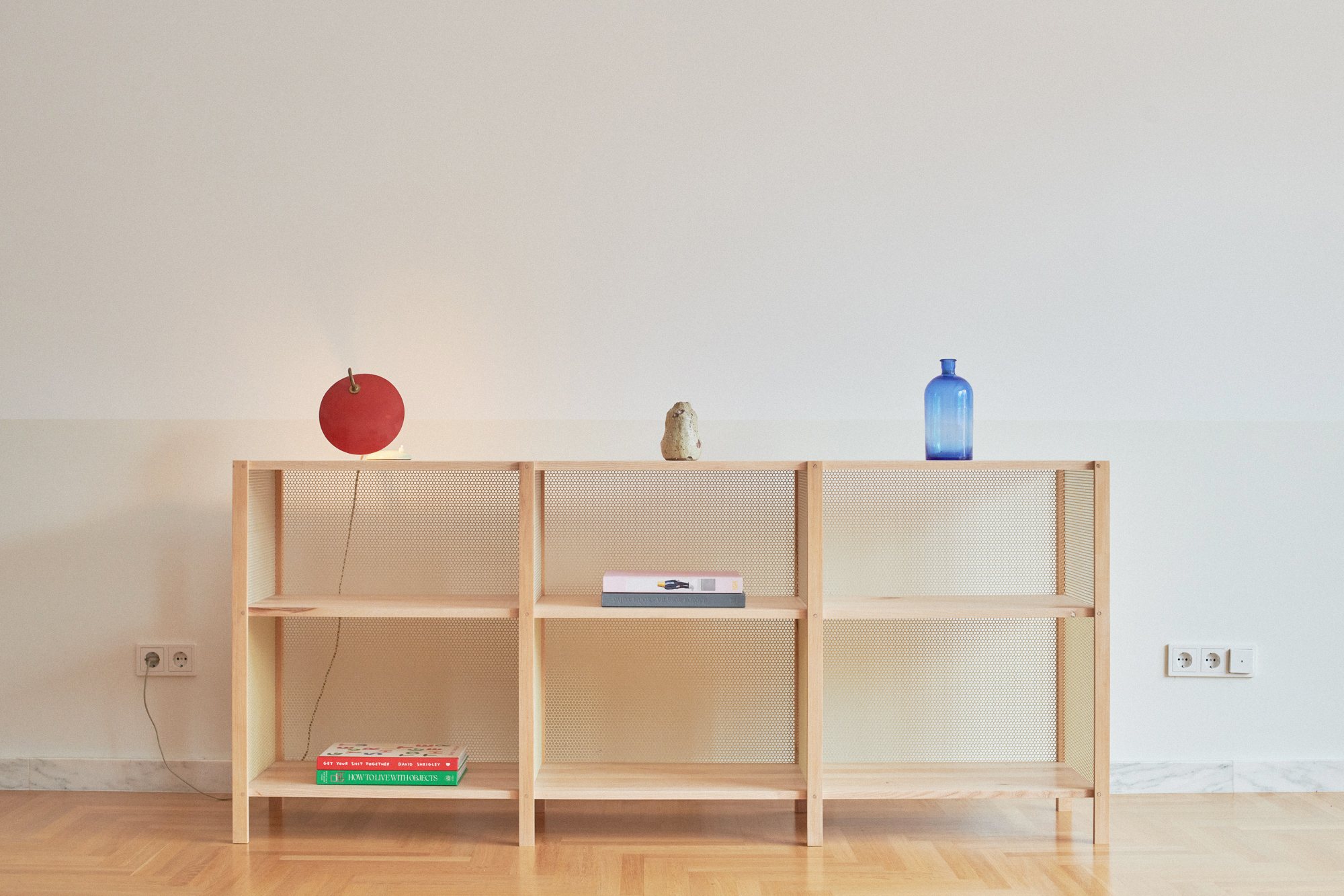 Low Honey Shelf in lacquered ash with perforated steel mesh