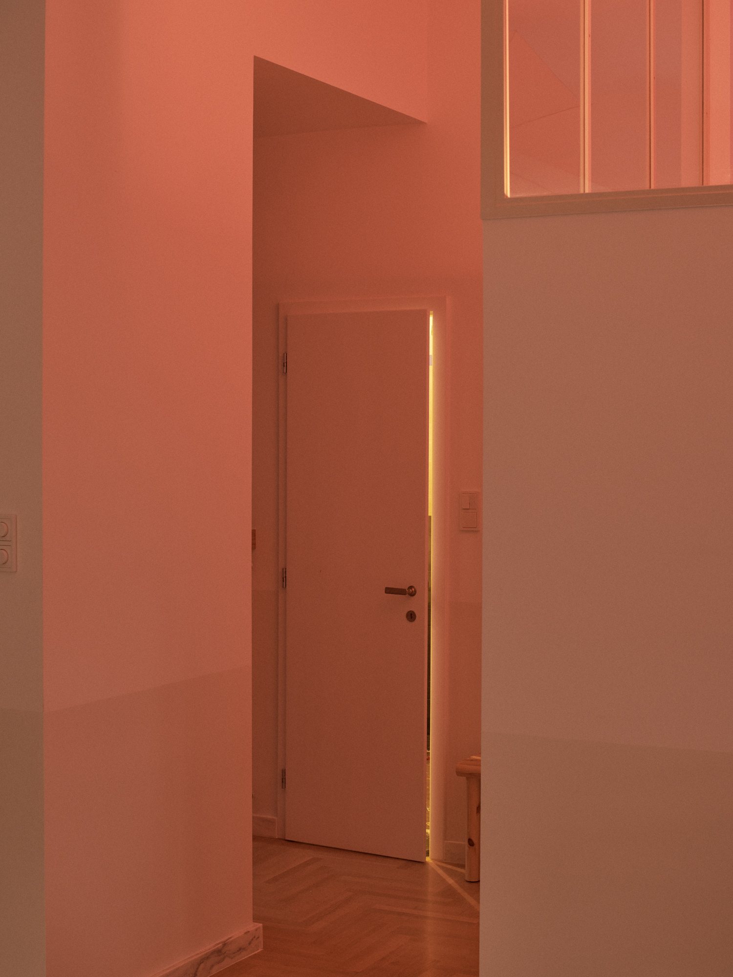 Coral hallway in the E6 apartment